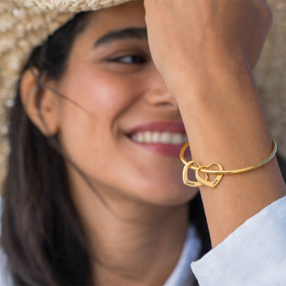 Bangle Bracelet with Heart Pendants in Gold