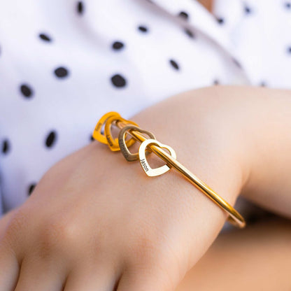 Bangle Bracelet with Heart Pendants in Gold